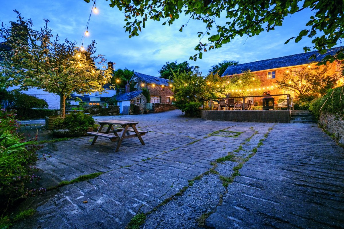 Trenderway - sociable courtyard lit up at night